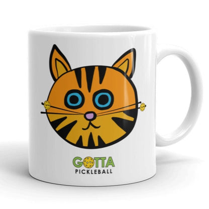 white glossy ceramic coffee mug with orange cat with pickleball whiskers gotta pickleball